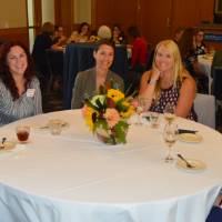 Six alumni gathered at a table at the KCON alumni reception